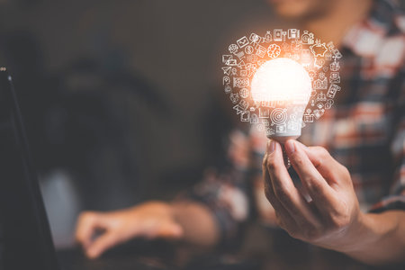 thinking and creative concept, Close up light bulb and working on the desk, Creativity and innovation are keys to success.Concept of new idea and innovation with Brain and light bulbs, working at homeの写真素材