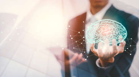 Businessman touch  brain icon and line control in graph Screen Icon of a media screen, Technology Process System,Concept Futuristic medicine, the human body, and the future,brain. Online consultation.の写真素材