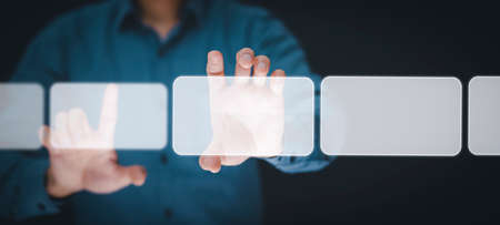 Businessman holding touch screen interface on the black background,graph Screen Icon of media screen, Technology Process System Business with Communication, conceptsの写真素材