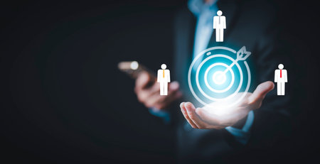 Targeting the business and human concept, Businessman holding arrow dart to virtual target dart...