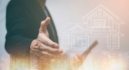 Businessman shaking hands Guarantees and care for residential homes concept,Property insurance and...