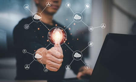 Man touching fingerprint of Cloud networking concept, touch screen with hand connection line on the White background, Cloud computing is system for sharing download and upload big data informationの写真素材