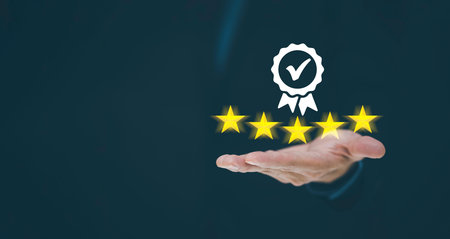 Businessman Hand shows the sign of the top service Quality assurance 5 star on the black background,...