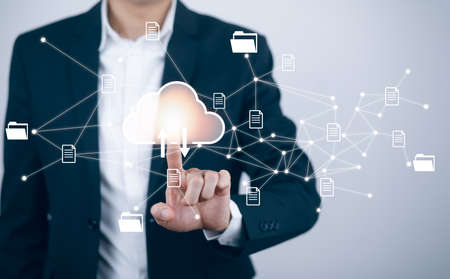 Man touching connect to data information on the Cloud Computing Technology Internet Storage Network Concept And a large database big data Through internet technology, Cloud sharing download and uploadの写真素材