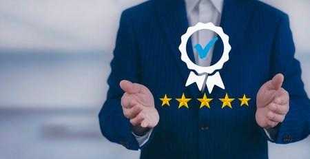 Quality assurance of business services and five star, Businessman hand shows the sign of the top...