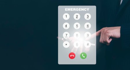 Dialing on virtual telephone keypad with Emergency and transparent telephone buttons, businessman...