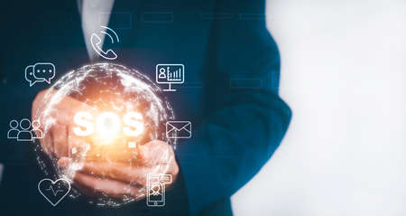 Man using Smart Phone with Emergency app in home, call phone, Chat message icon, Emergency application from smartphone for elderly, technology concept.Old hand touch mobile phone and call for help.の写真素材