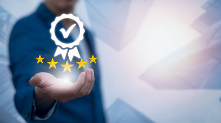 Quality assurance of business services and five star, Businessman hand shows the sign of the top...