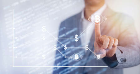 Crypto currency bitcoins high loss with red arrow down concept, Businessman touch bitcoins with arrows pointing down as Bitcoin BTC price falls, Cryptocurrency prices decline,Crypto Market Value downの写真素材