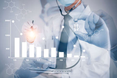 Doctor or scientist with a stethoscope holding COVID-19 vaccine, measles, coronavirus vaccine shot for diseases outbreak vaccination, vaccine Concept fight against virus covid-19 corona virusの写真素材