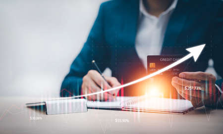 Businessman holding credit card for makes a purchase on the Internet on the laptop computer with credit card, online payment, shopping online, e-commerce, internet banking, spending money concept.の写真素材