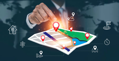 Businessman hand holding virtual world and model map with location point , GPS app, icon Travel maps...