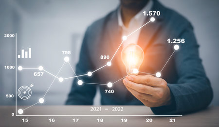 Businessman holding light bulbs, ideas of new ideas with innovative technology and creativity,...