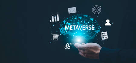 New metaverse with icon business concept,Business hand holding a virtual globe with financial icons future technology, business goals, online communication,graph Screen Icon of a media screen,big dataの写真素材