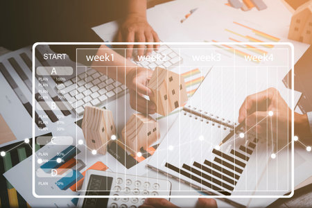 Project management and financial transactions online, business touch point at financial analyzing data while discussion, planning brand promotion budget, raising company awareness in social mediaの写真素材