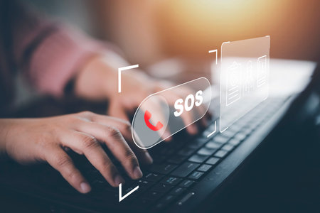 Hand touch button Emergency app in home, call phone, Chat message icon, Emergency application from smartphone for elderly, technology concept.Old hand touch mobile phone and call for help.の写真素材