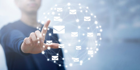 Man hand touch virtual world line with communication icons, letter icon, email icons, and newsletter email and protect your personal information or spam mail, Customer service call center contact.の写真素材