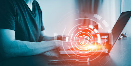 Hand Hacker touch laptop or smartphone and Touching in graph Screen code of a media screen on the White background, Technology Process System Business and hacks online concept, Copy spaceの写真素材