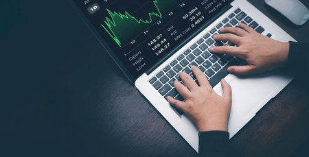 Woman using laptop with planning and strategy, Stock market, Business growth down, Concept of...