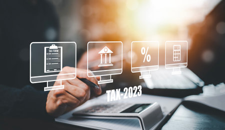 Concept of tax payment optimisation business finance,Man using calculator and taxes icon on technology screen,income tax and property, background for business, individuals and corporations such as VATの写真素材