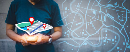 Businessman hand holding virtual world and model map with location point , GPS app, icon Travel maps...