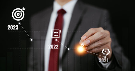Business growth data chart arrow with diagram 2023 budget, Businessman pointing arrow graph...