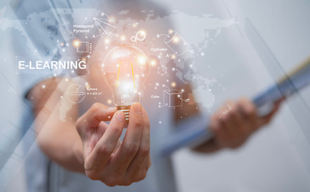 Concept E-learning education,Man holding light bulb with Education icon on virtual screen. internet...