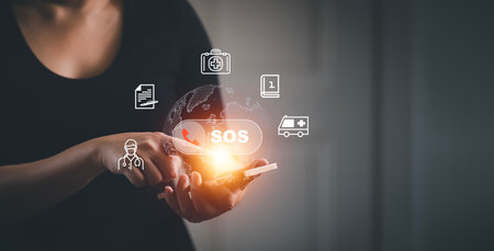 Woman using Smartphone with Emergency app in home, call phone, Chat message icon, Emergency application from smartphone for elderly, technology concept.Old hand touch mobile phone and call for help.の写真素材