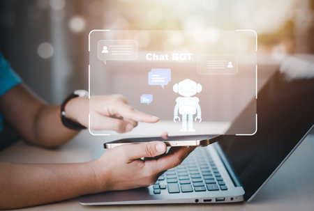 Man using Laptop and touch bar Chat bot Chat with AI, Artificial Intelligence,System Artificial intelligence an artificial intelligence chatbot, Digital chatbot, Robot application, conversationの写真素材