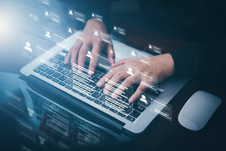 Businessman using laptop with Online documentation database, complete the online survey form, answer the test questions. Marked checklist on a clipboard. Human resources and management concept.の写真素材