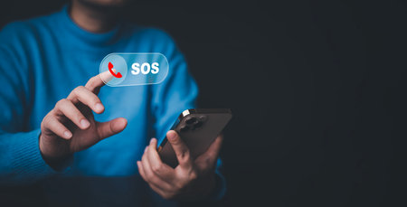 Businessman touch bar SOS Emergency app in home, call phone, Chat message icon, Emergency application from smartphone for elderly, technology concept.Old hand touch mobile phone and call for help.の写真素材