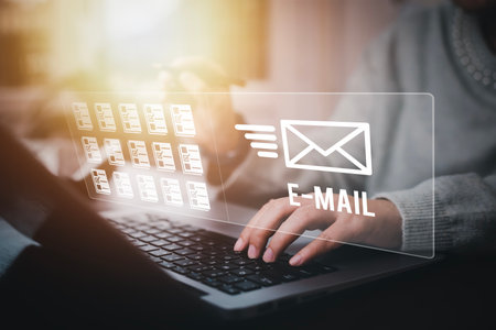Business people using laptop with communication icons, letter icon, email icons, and newsletter email and protect your personal information or spam mail, Customer service call center contact.の写真素材