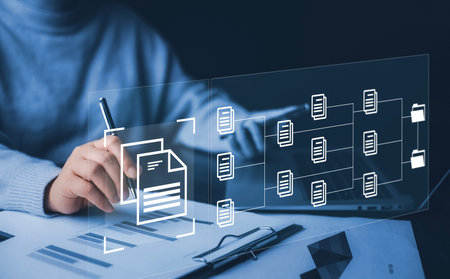 Businesswoman working on laptop with virtual screen. Online documentation database, IT consultant being set up Virtual Document Management System with laptop,Software for archiving corporate files.の写真素材