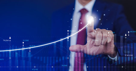 Businessman touchscreen line of Stock market or forex trading graph and candlestick chart suitable for financial investment concept,Economy trends background for business idea and all art work design.の写真素材