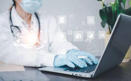 Medical doctors hands working Laptops with the modern interface as a medical network concept, DNA molecule research on the white background concept, Creation technologies for connection Mixed mediaの写真素材
