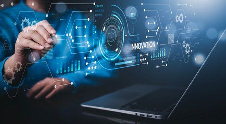 Innovation with Graphical User Interface and big data Concept, businessman using a laptop with touch Innovative ideas presented by management consultants on-screen, design, invention developmentの写真素材