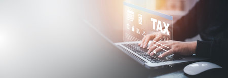 Business people Hand using tablet with bar  TAX REFUND and refund tax of duty taxation business, graphs and chart being demonstrated on the screen media,  tablet pc and selecting tax refund.の写真素材