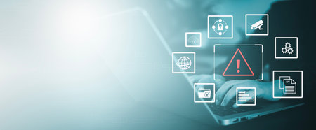 Man using smartphone with triangle caution warning sign for notification error, Programmer using laptop with triangle caution warning sign, hacker attacks and hacking data, cyber crime, cyber securityの写真素材