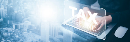 Business people working laptops with bar  TAX REFUND and refund tax of duty taxation business, graphs and charts being demonstrated on the screen media,  tablet pc and selecting tax refund.の写真素材