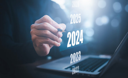 Changes in new planning, Businessman hand touch on the 2024 year number, start new year concept...
