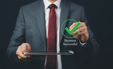 Businessman with Online payment, Hand hold smartphone banking online bill payment Approved concept button, credit card and network connection icon on business technology virtual screen backgroundの写真素材