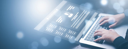 Businesswoman working on laptop with virtual screen. Online documentation database, IT consultant being set up Virtual Document Management System with a laptop, Software for archiving corporate files.の写真素材