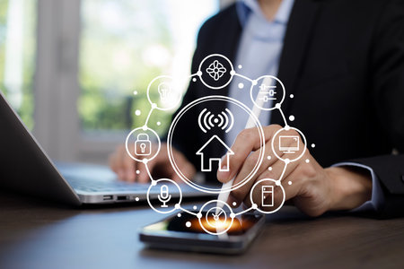 Hand using AI smart tablet with smart home app on the room, circular interface of the smart home automation assistant on the virtual screen and user touches the button, smart home digital interfaceの写真素材