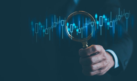 Ideas and perspectives, Stock investment stock market for analysis technical grap. Businessman hand holding magnifying glass with virtual stock market chart, Business investment earning income conceptの写真素材
