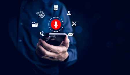 Businessman using smartphone touch microphone button on virtual screen. Blog blog speak talk advertising presentation,Voice recognition, speech detection and deep learning application,Voice Assistanceの写真素材