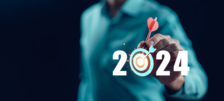 Changes in new planning, Hand using laptop with number 2024 new year, start new year concept digital trends,industry and business trend, strategy, investment, business planning and happy new yearの写真素材