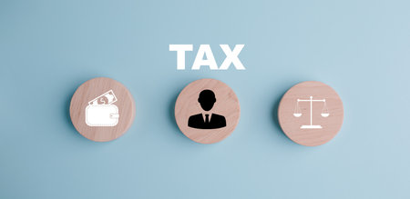 Tax with Saving Bank and wooden block cube concept, , tax payment optimisation business finance, wooden home  with taxes icon on technology screen, income tax and property, corporations such as VATの写真素材
