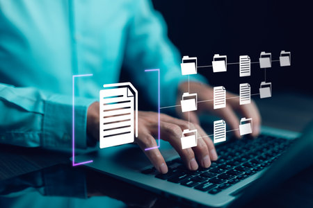 Online documentation database and document management system concept, Businessman using a tablet or computer, Document Management System and Automation software to archiving and efficiently manage.の写真素材