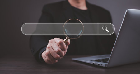 Searching Browsing Internet Data Information with blank search bar. man hold magnifying glass to Searching for information. Using Search Console with your website.の写真素材