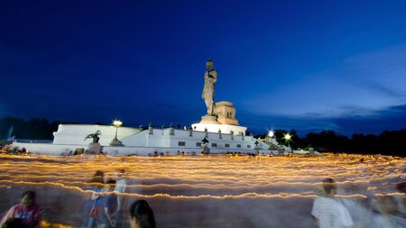 NAKORNPRATHOMTHAILAND  Plenty of Thai Buddhism hold the fired candle in hand walking around the Buddhist on Visakhabucha day at Phutthamonthol on May 1st 2015のeditorial素材